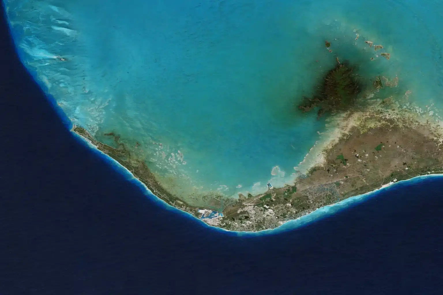 Aerial map of Grand Bahama Island showing Freeport, West End, and Deep Water Cay access by private charter flight