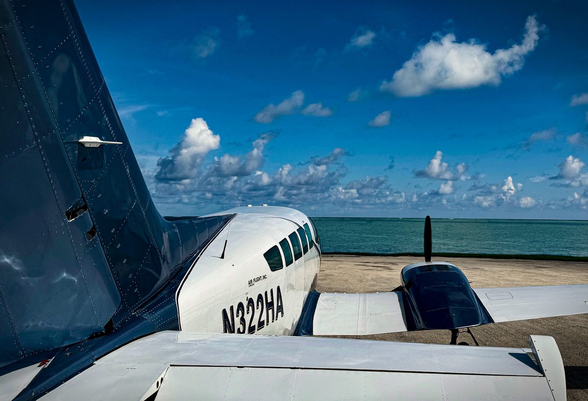 Bahamas Charter Flights Cessna 402 private charter aircraft parked at oceanfront runway in the Abacos Bahamas